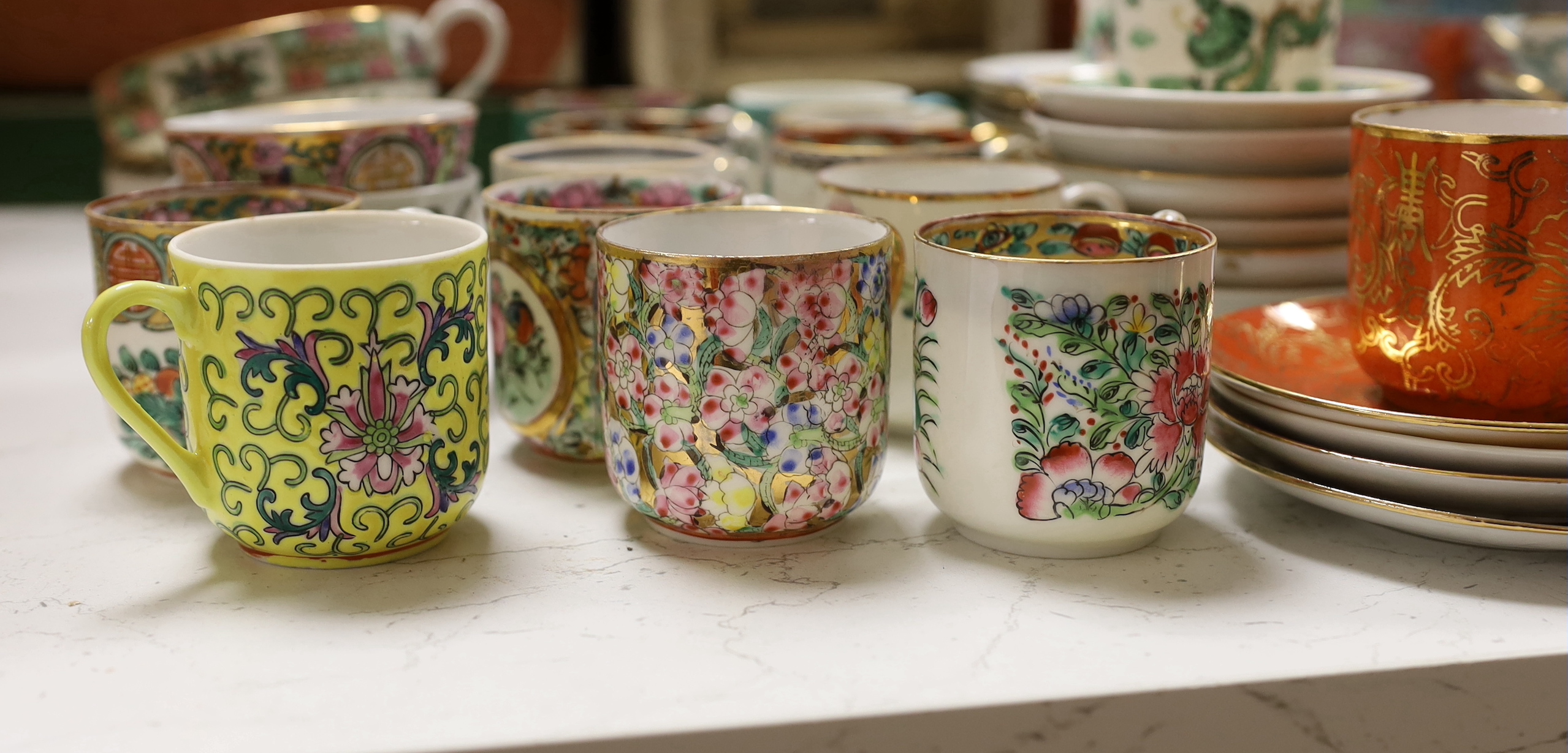 A group of Chinese enamelled porcelain coffee cups and saucers, and similar petal lobed bowls, mid 20th century